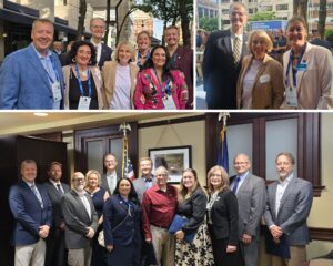 Senator Hutchinson and Group of realtors smiling broadly after a meeting while looking toward the camera.
