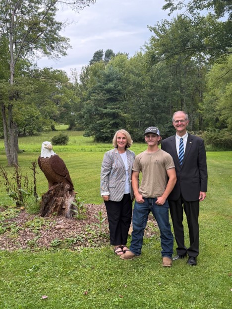 Senator Hutchinson Alt Text Eagle Scout Dominic Cancilla and Rep. Mustello.