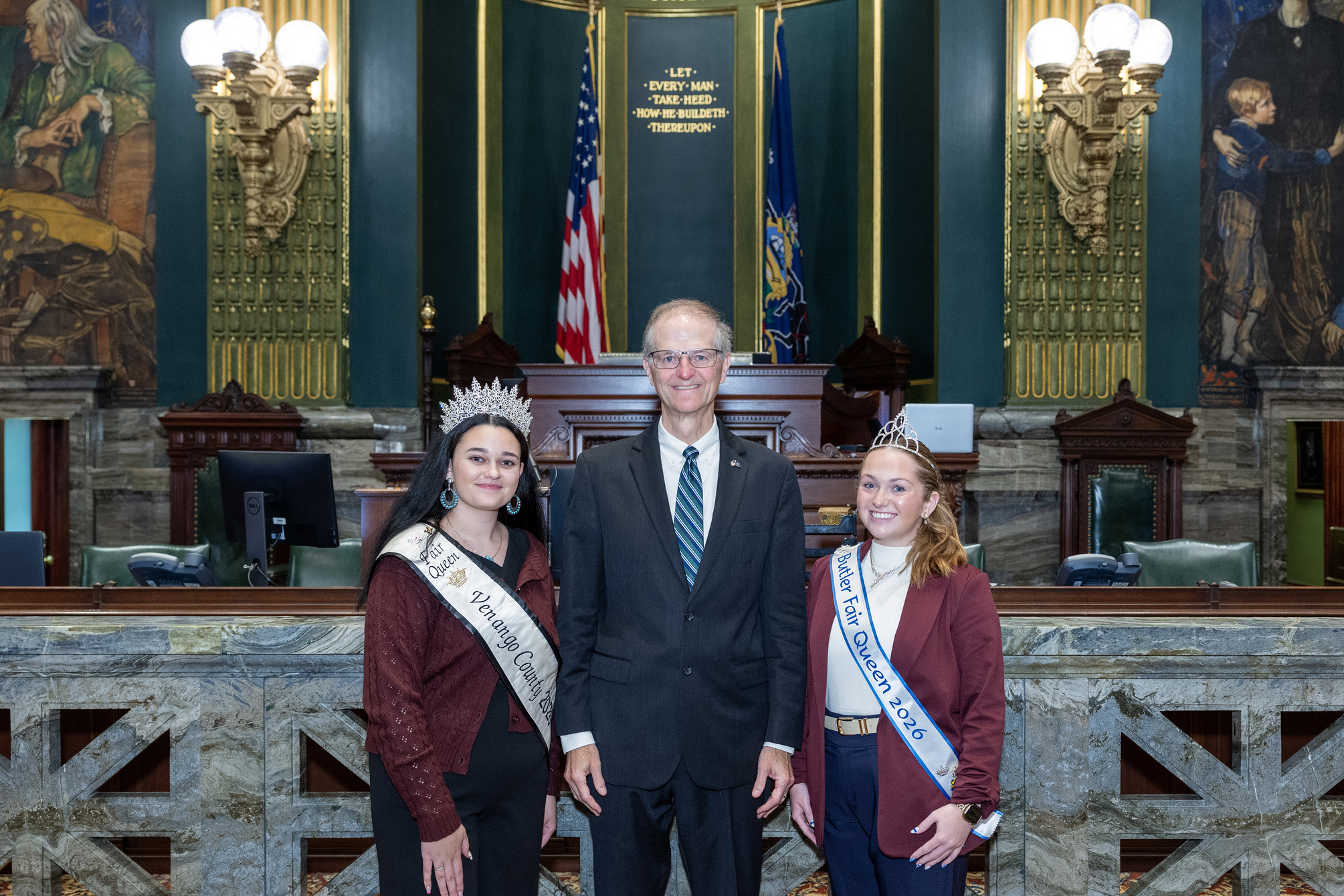 Senator Hutchinson Alt Text Venango County Fair Queen, Avery Metz, and Butler County Fair Queen, Rylee Colteryahn, smiling for a photo in the Pennsylvania Senate Chamber.